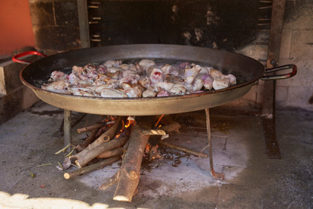 First step when cooking a good paella is to well fry the meatの写真素材