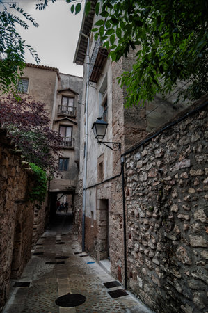narrow street of the medieval city of Cuenca, Spainの写真素材