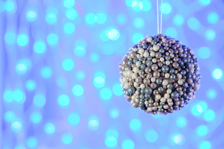 Christmas decoration on the background of blue lightsの写真素材