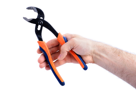 man's hand hold adjustable wrench in open position, isolated on white background close-upの写真素材