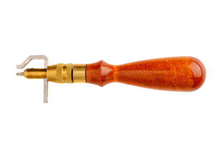 Stitching Groover with wooden handle isolated on white backgroundの写真素材