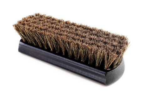 dark brown wooden shoe shine polish brush on white background isolate, close upの写真素材