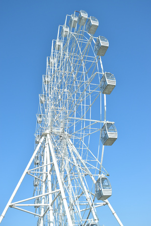 attraction ferris wheel on blue sky backgroundの写真素材