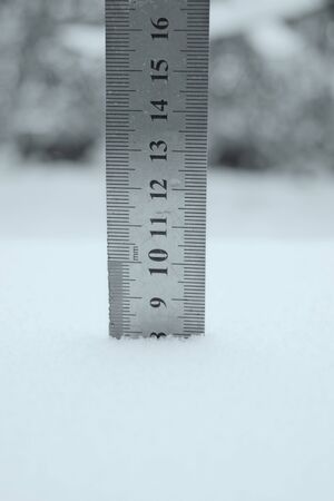 photo with a centimeter ruler as an indicator of snow depthの写真素材