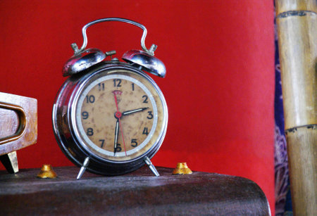 an old analog alarm clock