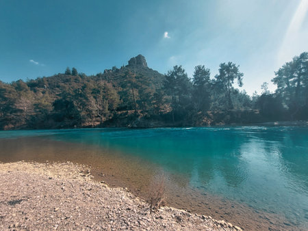 Turquoise water of the mountain river. The concept of active and photo tourism