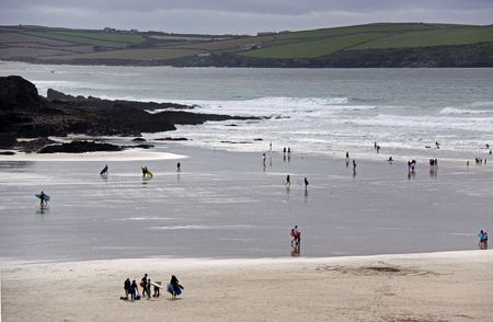Beautiful coast / sea view of surfers and swimmers in Cornwall, UK