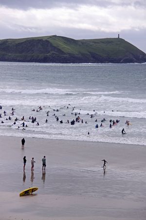 Beautiful coast view of surfers and swimmers in Cornwall, UKの写真素材