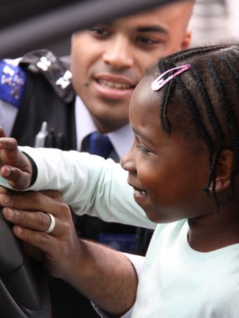 Balham, London, UK, May 16th 2009 British Police man and child at a street party