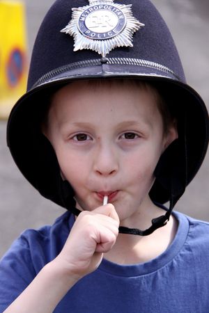 Balham, London, UK, May 16th 2009 boy wearing an original police helmet at a street party