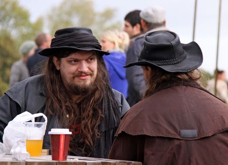 Middle Farm Apple Festival, Lewes, UK, 17 October 2009 two men in cowboy style clothing drinking scrumpy ciderのeditorial素材