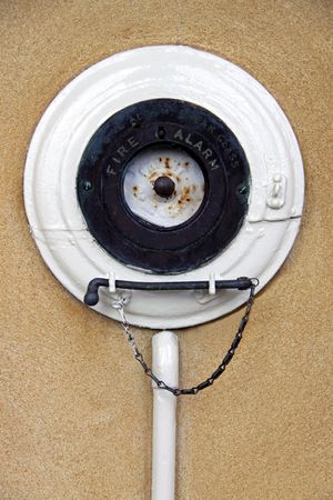 An old antique fire alarm bell with hammerの写真素材