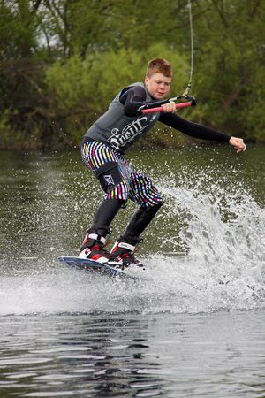 Heron Lake, Wraysbury, UK April 25th 2010 A boy Wake Boarder / wakeboarding at the British Disabled Water Ski-ing Association BDWSAのeditorial素材