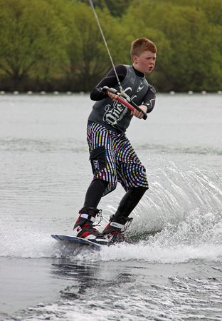 Heron Lake, Wraysbury, UK April 25th 2010 A boy Wake Boarder / wakeboarding at the British Disabled Water Ski-ing Association BDWSAのeditorial素材
