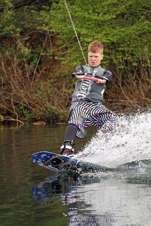 Heron Lake, Wraysbury, UK April 25th 2010 A boy Wake Boarder / wakeboarding at the British Disabled Water Ski-ing Association BDWSAのeditorial素材