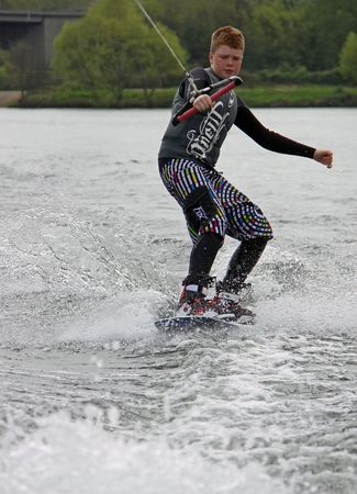 Heron Lake, Wraysbury, UK April 25th 2010 a young boy Wake Boarder / wakeboarding at the British Disabled Water Ski-ing Association BDWSAのeditorial素材
