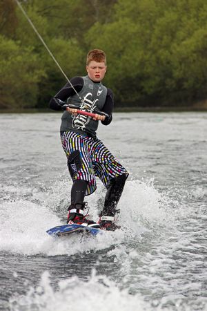 Heron Lake, Wraysbury, UK April 25th 2010 a young boy Wake Boarder / wakeboarding at the British Disabled Water Ski-ing Association BDWSAのeditorial素材
