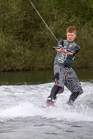 Heron Lake, Wraysbury, UK April 25th 2010 a young boy Wake Boarder / wakeboarding at the British Disabled Water Ski-ing Association BDWSAのeditorial素材