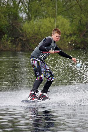 Heron Lake, Wraysbury, UK April 25th 2010 a young boy Wake Boarder / wakeboarding at the British Disabled Water Ski-ing Association BDWSAのeditorial素材