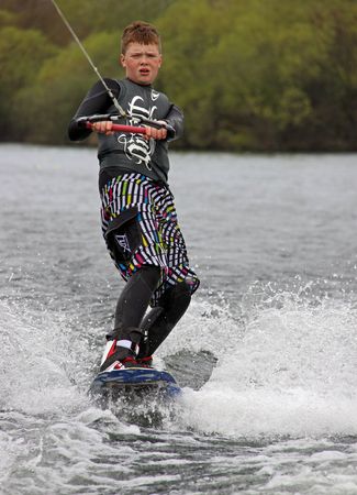 Heron Lake, Wraysbury, UK April 25th 2010: a young boy Wake Boarder / wakeboarding at the British Disabled Water Ski-ing Association BDWSAのeditorial素材