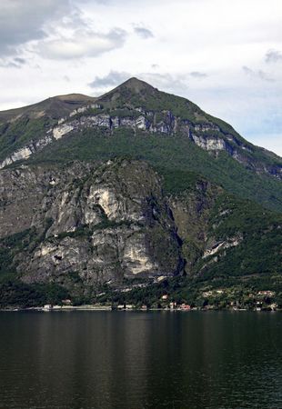 View of tree covered mountain and Lake Como in Italyの写真素材