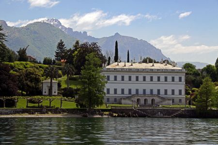 A house on the shore of Lake Como in Italy with Treviso mountainsの写真素材