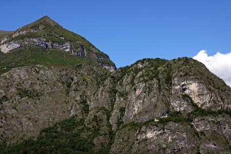 Scene of tree covered mountains at Lake Como in Italyの写真素材