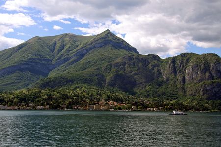 Scene of tree covered mountains and Lake Como in Italyの写真素材