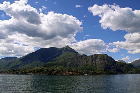 Scene of tree covered mountains and Lake Como in Italyの写真素材