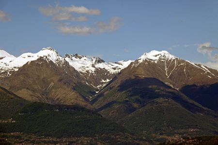 Scene of snow topped Treviso mountains at Lake Como in Italyの写真素材
