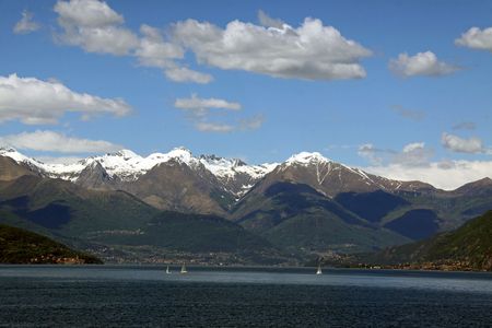 Scene of snow topped Treviso mountains at Lake Como in Italyの写真素材
