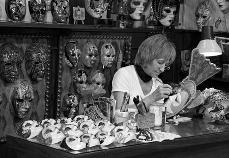 Venice, Italy, 21/5/10 the owner of a papier mache art shop painting a maskのeditorial素材