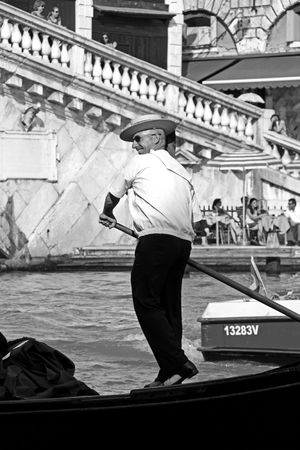 Venice, Italy, 21/5/10 Italian gondolier on a gondola on the Venice Grand Canalのeditorial素材