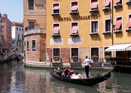 Venice, Italy, 21/5/10 Italian gondolier and tourists in a gondolaのeditorial素材