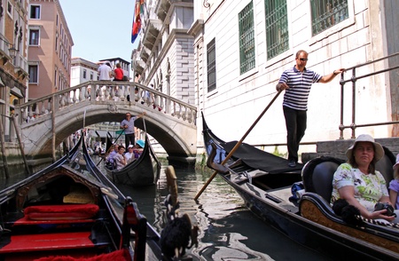 Venice, Italy, 21/5/10 Italian gondoliers and tourists in gondolasのeditorial素材