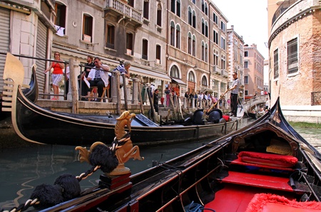 Venice, Italy, 21/5/10 Italian gondolier and tourist passengers in a gondola in a Venetian canalのeditorial素材