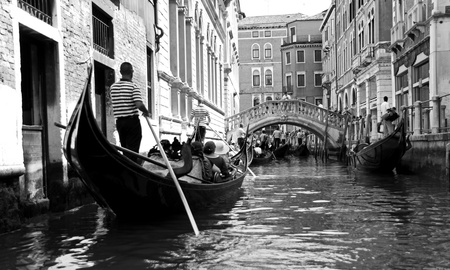 Venice, Italy, 21/5/10 Italian gondoliers and tourist passengers in a gondola in a Venetian canalのeditorial素材