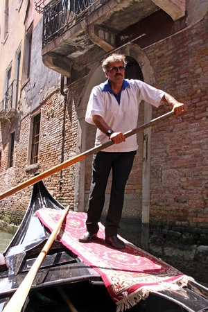 Venice, Italy, 21/5/10 Italian gondolier in a gondola in a Venetian canalのeditorial素材