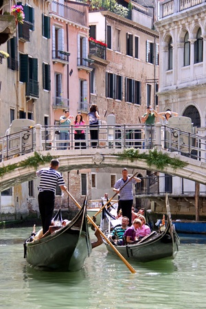 Venice, Italy, 21/5/10 Italian gondoliers and tourist passengers in gondolas on a Venetian canalのeditorial素材