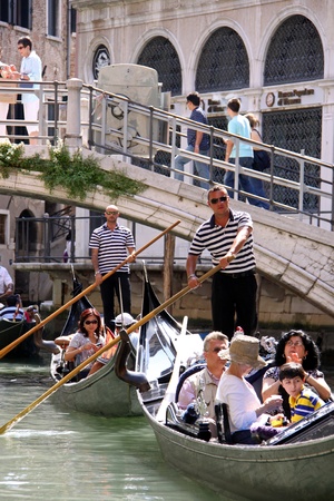 Venice, Italy, 21/5/10 Italian gondoliers and tourist passengers in gondolas on a Venetian canalのeditorial素材