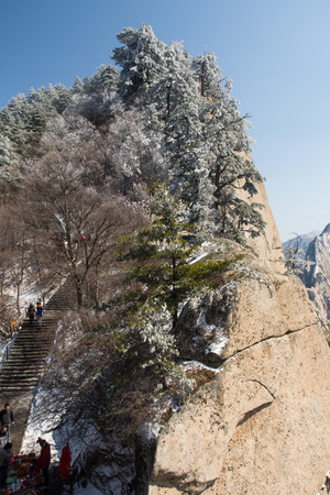 People walking up the steps of Hua Shan in Shaanxi Province, Chinaのeditorial素材