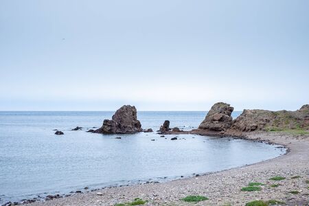 Beach with rocks in the background at Los Escullos, on a cloudy day.の写真素材