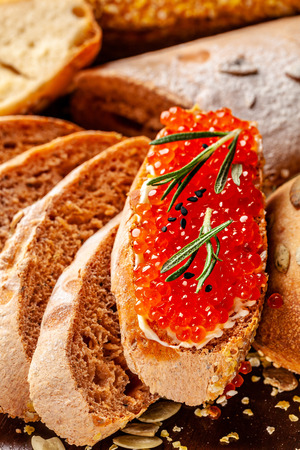Ukrainian and Russian cuisine. Red caviar with homemade wholegrain bread.の写真素材