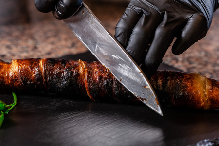 The concept of Georgian cuisine. Recipe for cooking meat lyulya kebab in the dough on the grill. Chef puts meat on a skewer.の写真素材