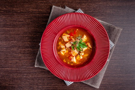 French cuisine concept. Classic French fish soup of seafood, shrimps, mussels, squid, potatoes, tomatoes. Beautiful serving dishes in the restaurant. copy spaceの写真素材