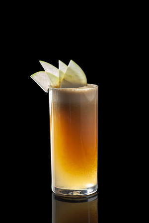 Classic fresh juices from fruits and vegetables on a black background in glass cups, cocktails. Drinks with bottom ejection. Isolate for the menu of restaurants, bars and cafes.の写真素材