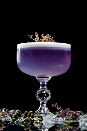 Alcoholic drinks and cocktails for bars and restaurants with ice on a black background in glass glasses. For the menu.の写真素材