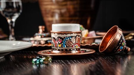 The concept of Turkish cuisine. Turkish brewed black coffee. Beautiful coffee serving in the restaurant. Background image. copy spaceの写真素材