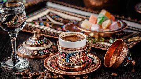 The concept of Turkish cuisine. Turkish brewed black coffee. Beautiful coffee serving in the restaurant. Background image. copy spaceの写真素材