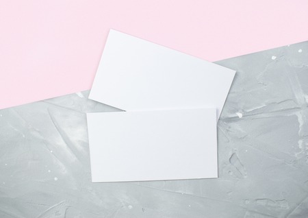 Universal mockup of a two bank gift cards placed vertically with shadows on a gray background. Top of view.の写真素材